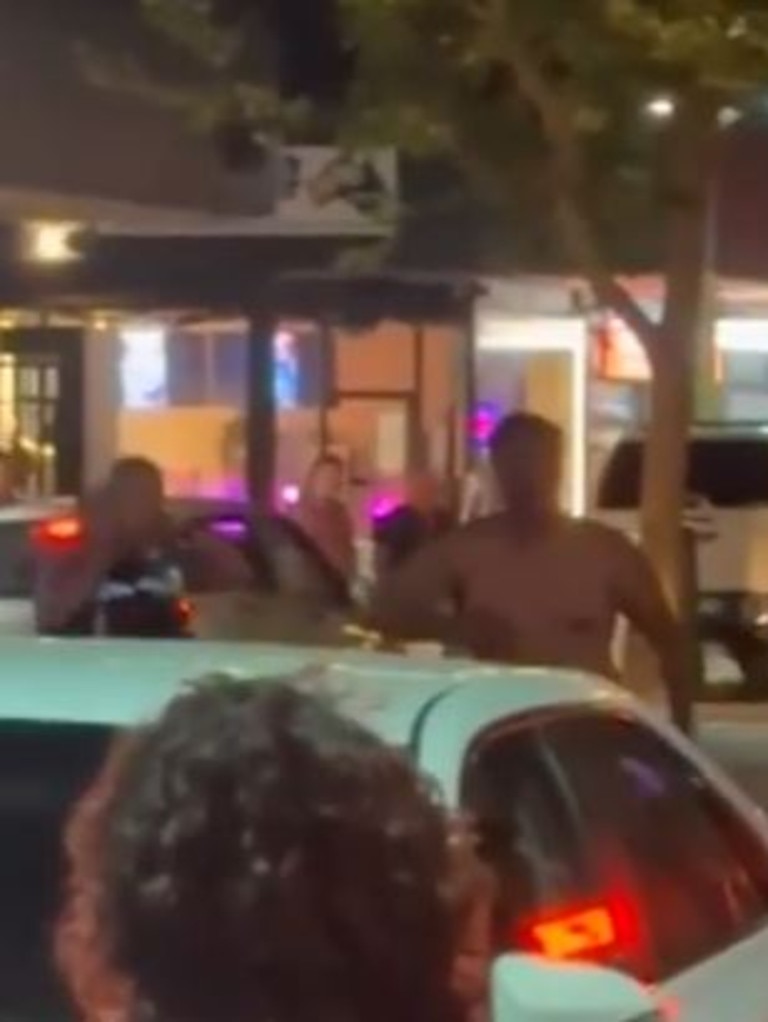 The naked man can be seen walking away from police on the street. Picture: 7News