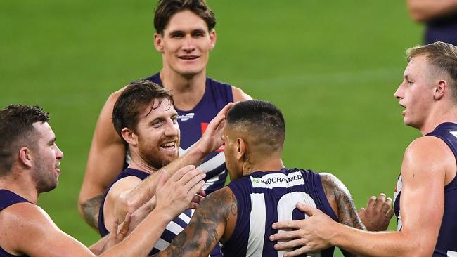 PERTH, AUSTRALIA - APRIL 24: Reece Conca and Michael Walters of the Dockers celebrates a goal during the 2021 AFL Round 06 match between the Fremantle Dockers and the North Melbourne Kangaroos at Optus Stadium on April 24, 2021 in Perth, Australia. (Photo by Daniel Carson/AFL Photos via Getty Images)