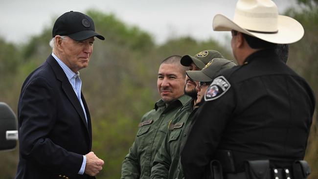 US President Joe Biden speaks with US Border Patrol agents as he visits the US-Mexico border in Brownsville, Texas, on February 29, 2024. (Photo by Jim WATSON / AFP)