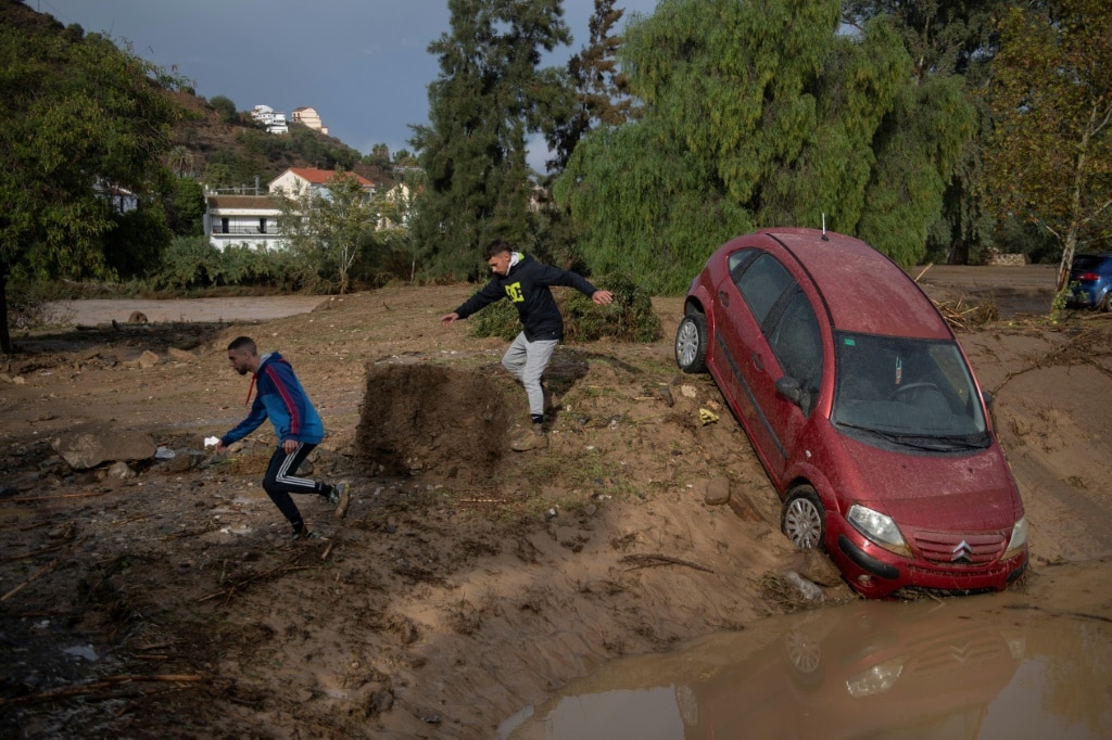 Emergency services rescued scores of people in Alora in Andalusia in southern Spain after a river overflowed.