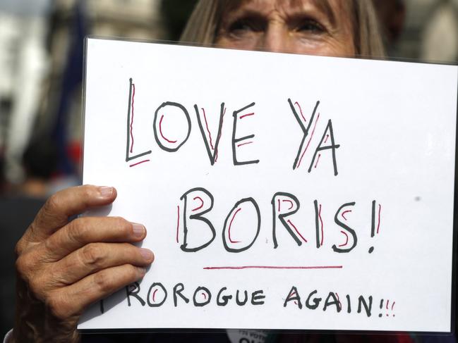 A leave supporter holds a sign supporting British Prime Minister Boris Johnson. Picture: Frank Augstein