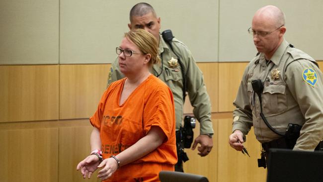 Defendant Lisa Cunningham is escorted back to a holding cell by Maricopa County Sheriff's officers on Sept. 12, 2018 at the Superior Court of Arizona in Maricopa County South Tower in Phoenix. Picture: Caitlin O'Hara/ News Corp Australia