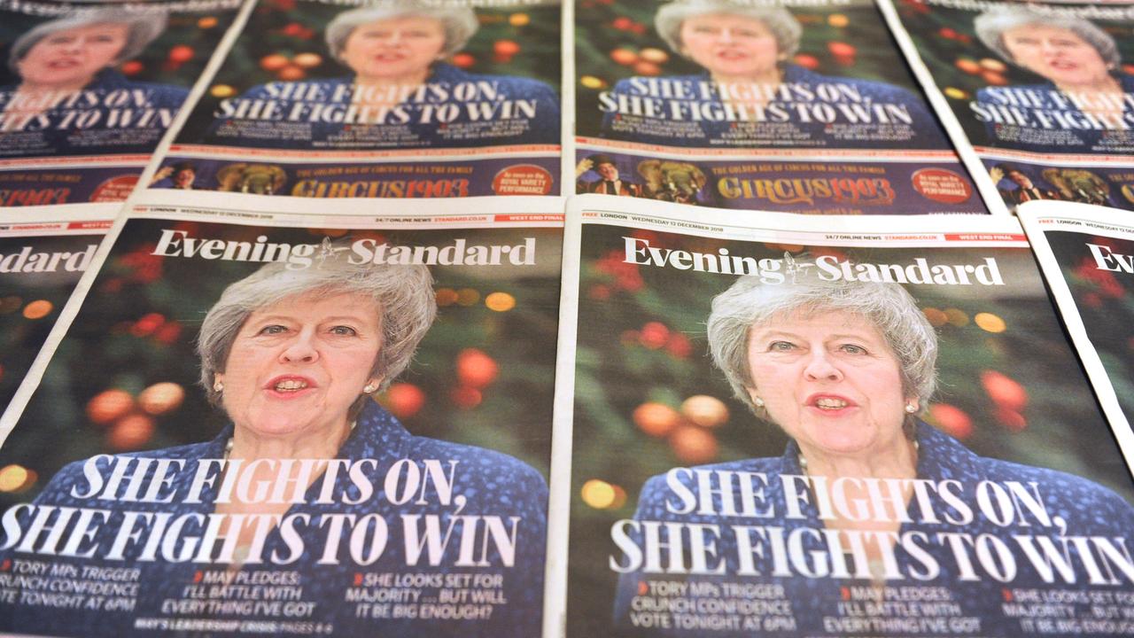 Copies of the Evening Standard, London's daily free newspaper with Britain's Prime Minister Theresa May on the front cover following the vote. Picture: AFP 