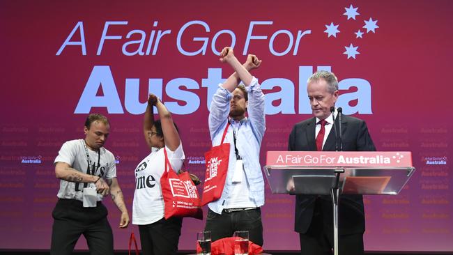 Asylum seeker protesters on stage at Labor’s national conference. Picture: AAP / Lukas Coch 