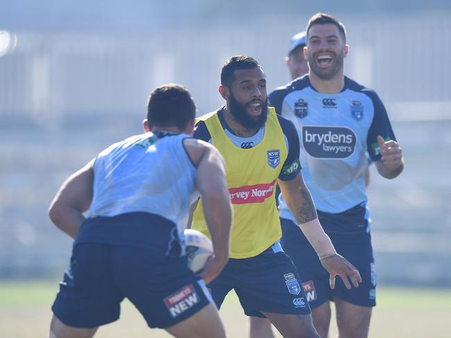 Josh Ado-Carr (centre) cracks a joke during the team training session. Picture: AAP Image/David Moir