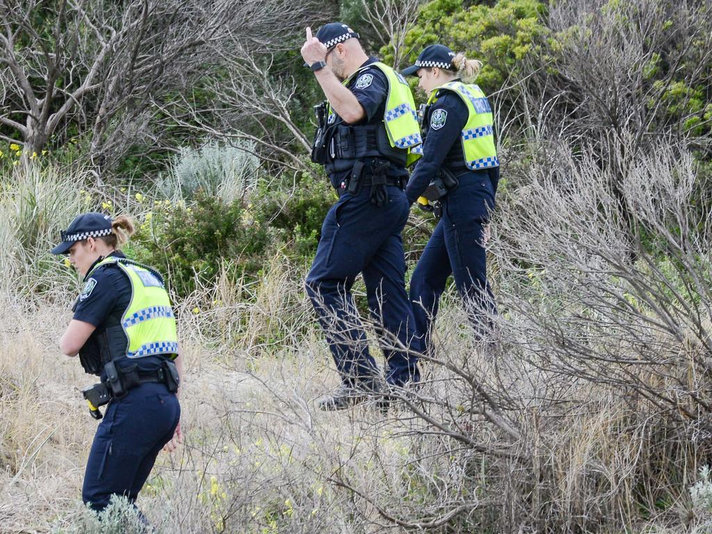 Police search Sandhills at Aldinga Beach. There is no suggestion the officers in question are among the group.