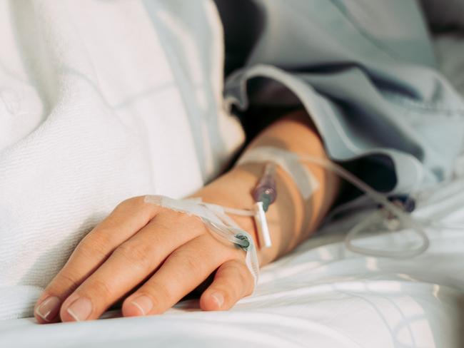 Asian woman lying sick in hospital.