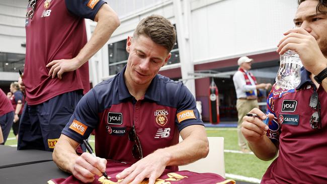 Dayne Zorko signs autographs at the Lions end of season fan day in Brisbane. Picture: Josh Woning