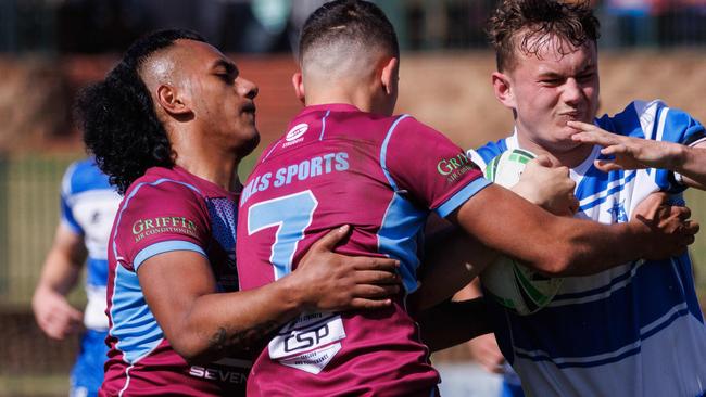 DAILY TELEGRAPH AUGUST 16, 2023Hills Sports High (maroon) versus St Dominics in the NRL School Boys Competition at Windsor today. Pictured is Key Raven with the ball. Picture: David Swift.