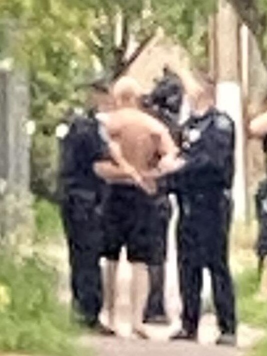 Police took a man from a home on Liascos Ave just before 7pm. Picture: Patrick James