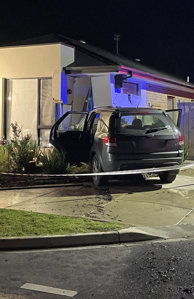 A Ford SUV has slammed into a house on the corner of Eaglebay Rd and Shipstern St in Armstrong Creek. Picture: Luke Griffiths.