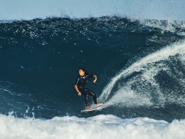 A surfer in action at Sunrise Beach as a southerly swell from an east coast low pushes big waves into south east. Queensland. Photo Lachie Millard