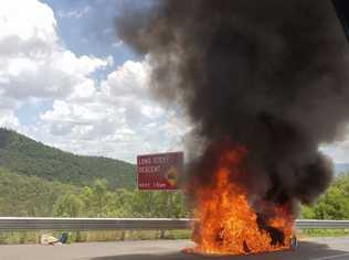 The car on fire on the eastbound lanes of the Warrego Highway on the Toowoomba Range. Picture: 7 News Toowoomba