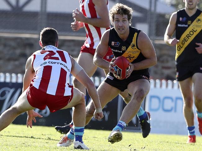 SANFL - Glenelg v North Adelaide at ACH Group Stadium. Matthew Snook tries to get past ALexander Spina Picture SARAH REED