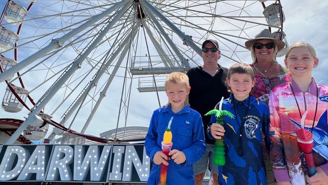 Harry Theodore, Nicole Theodore and grandkids Hudson Mitchell, 7, Emerson Mitchell, 9, and Kaeleigh Mitchell, 10, are enjoying the newly opened Skyline Ferris Wheel at Darwin's Stokes Hill Wharf on their family holiday from Tweed Heads. Picture: Fia Walsh