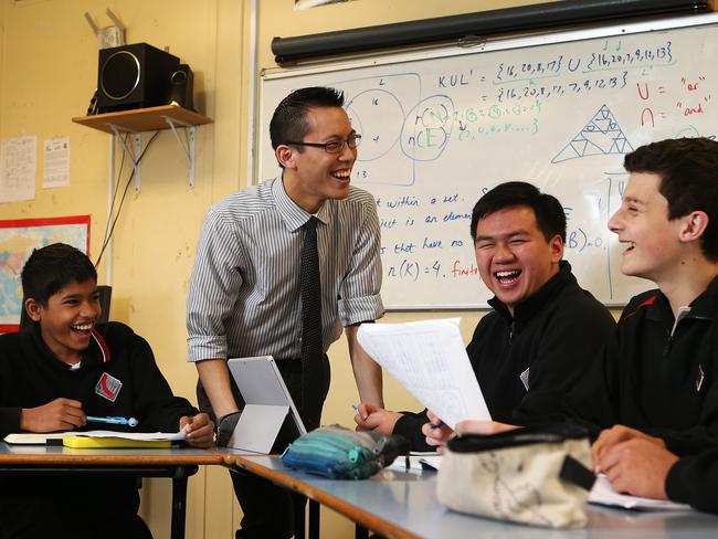 Eddie Woo shares a joke with some of his students, from left:..Aravind Venkateswaran, William Khoo and Harrison Beer. Picture: John Feder