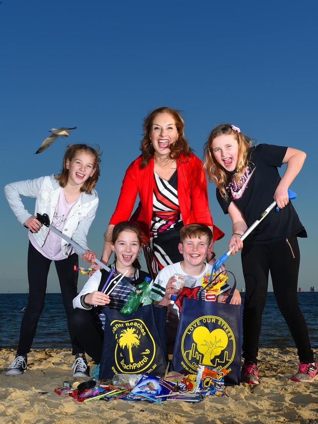 Eliza (10), Bernadene Voss (mayor), Tully (10), (bottom) Matilda (9) and Callum (11) collect rubbish along Port Phillip Bay. Picture: Josie Hayden