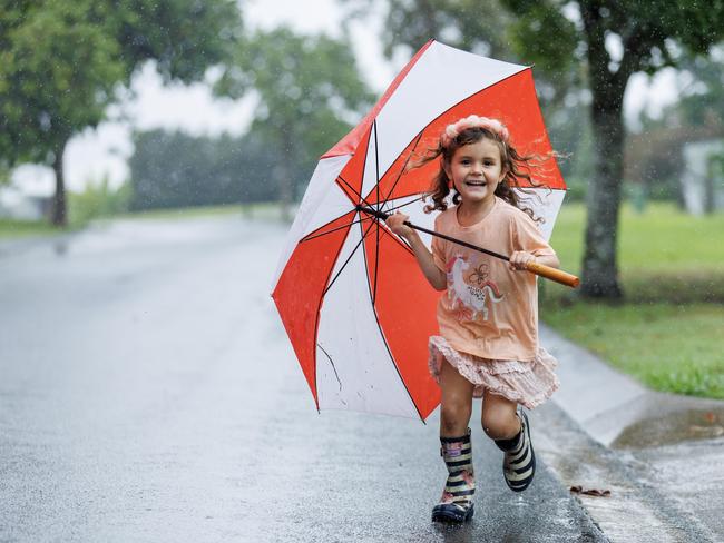 Five-year-old Lennie Robb embraces the wet weather at Ninderry on the Sunshine Coast. Picture Lachie Millard