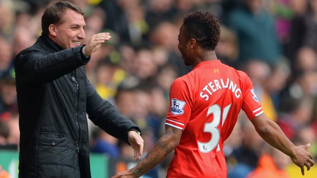 NORWICH, ENGLAND - APRIL 20: Raheem Sterling of Liverpool celebrates scoring the opening goal with Manager Brendan Rodgers of Liverpool during the Barclays Premier League match between Norwich City and Liverpool at Carrow Road on April 20, 2014 in Norwich, England. (Photo by Michael Regan/Getty Images)