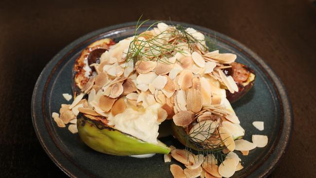 Wood-fired figs with stracciatella, prune, native honey and almonds. Picture: Annette Dew