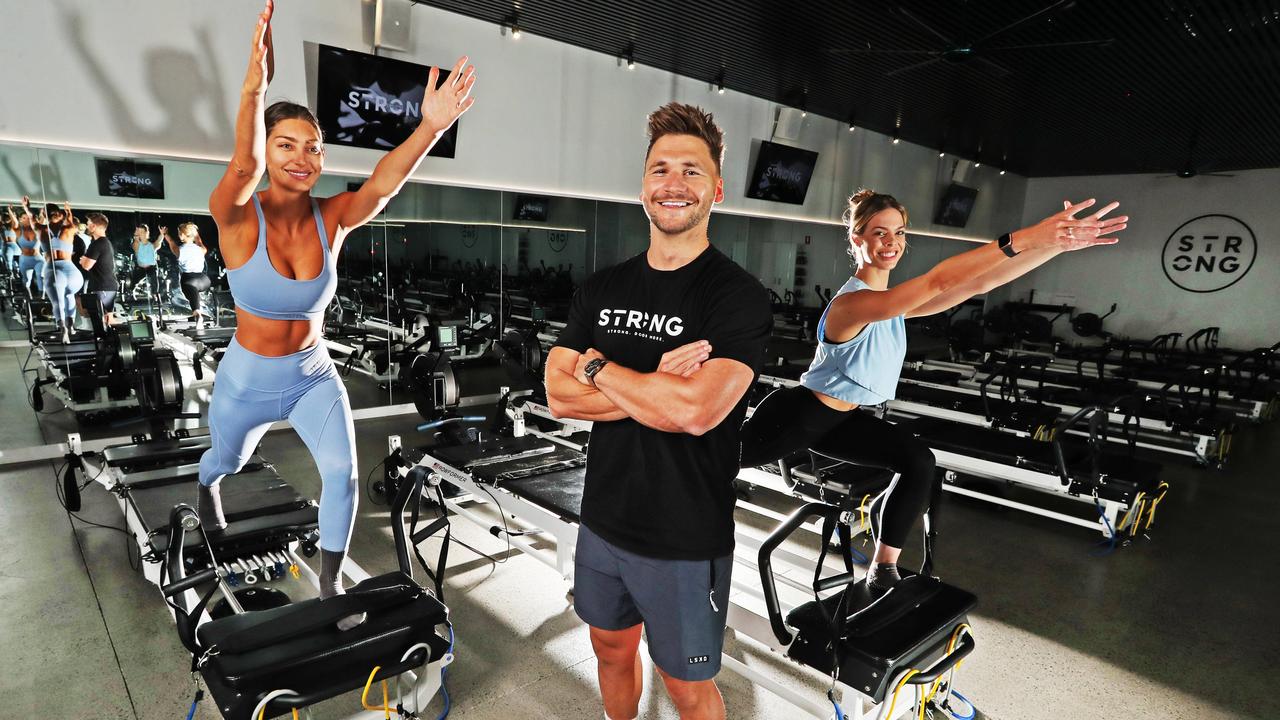 Michael Ramsey is the founder of STRONG Pilates, pictured with Leah Johnsen and Michelle Nowland (right). Picture: Nigel Hallett