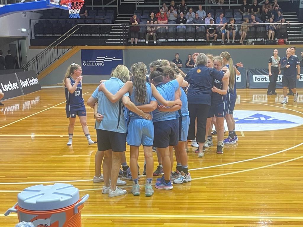 NSW and Victorian Ivor Burge players embrace after the Ivor Burge women's gold medal game.