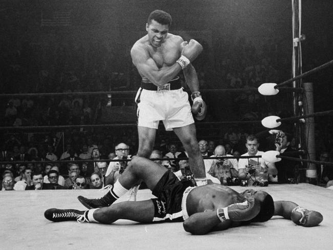 Muhammad Ali stands over challenger Sonny Liston in 1965