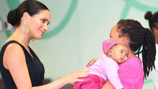 Meghan, Duchess of Sussex meets with with 7-week-old Sumeya during her royal tour of South Africa with Prince Harry in September. Picture: Paul Edwards/Getty Images