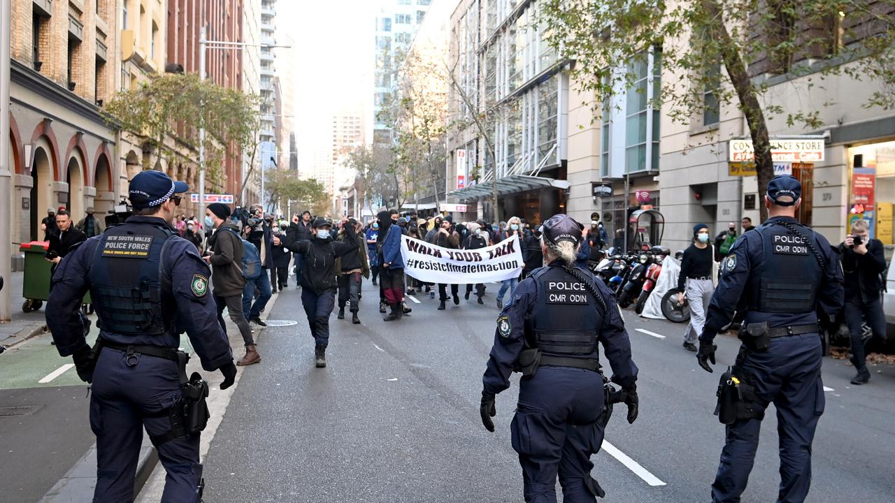 Police officers followed in step behind protesters marching through the streets. Picture: NCA NewsWire / Jeremy Piper