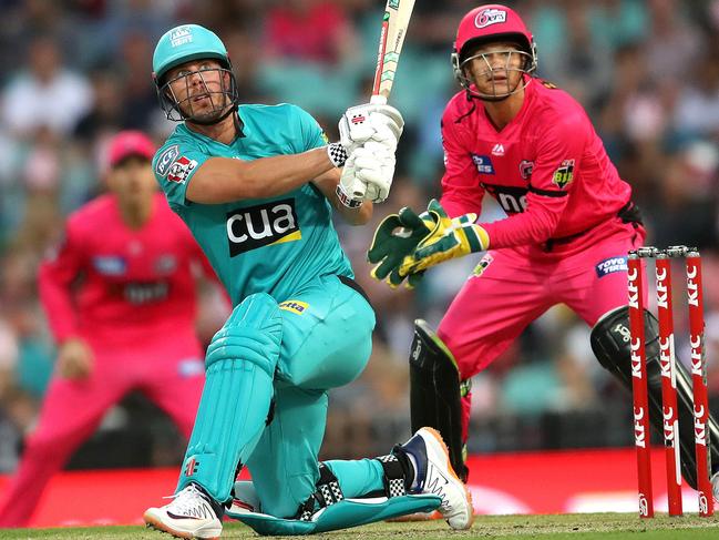 Brisbane Heat's Chris Lynn smashes a huge six against the Sydney Sixers. Picture. Phil Hillyard