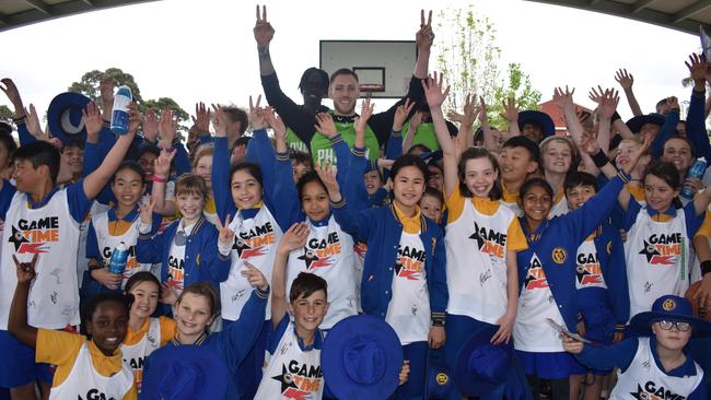 King of the kids Mitch Creek with students at Burwood Heights Primary School. Picture: Kiel Egging