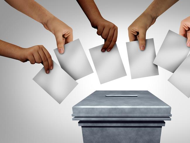 Community vote and voting diversity concept and diverse hands casting ballots at a polling station as a democratic right in a democracy as multicultural hands holding a blank paper with 3D illustration elements. Picture: iSTOCK