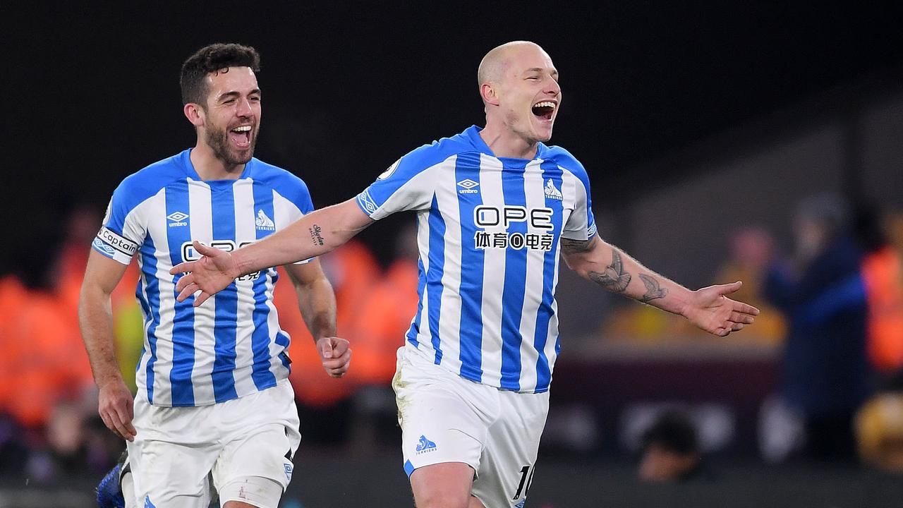 Aaron Mooy of Huddersfield celebrates after scoring.