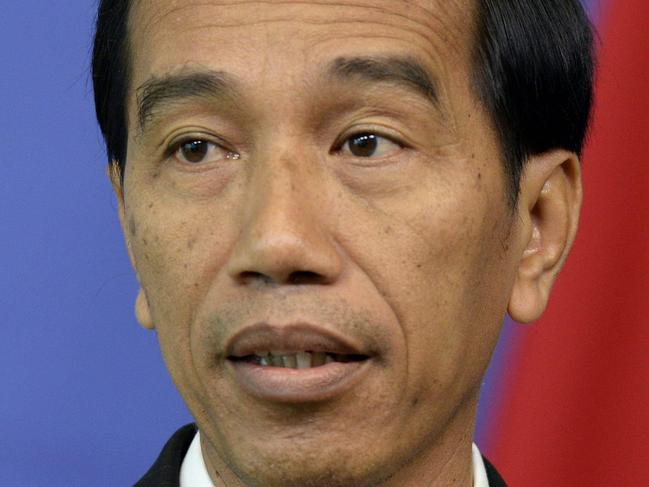 Indonesian president Joko Widodo gives a press conference following his meeting with European Union officials at the European Parliament in Brussels, on April 21, 2016. / AFP PHOTO / THIERRY CHARLIER