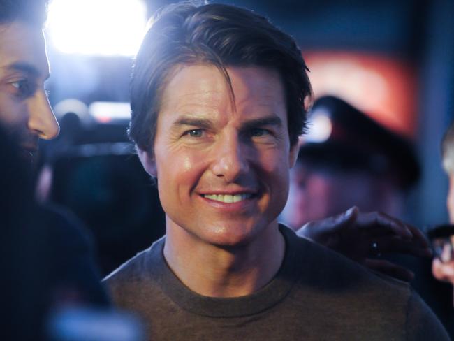 Tom Cruise smiles on the red carpet at the <i>Edge of Tomorrow </i>premiere in Toronto.