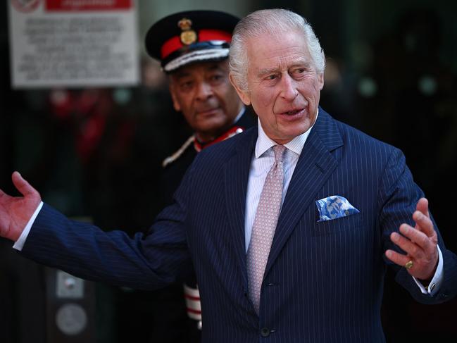 King Charles appears in good spirits during his return to work. Picture: AFP