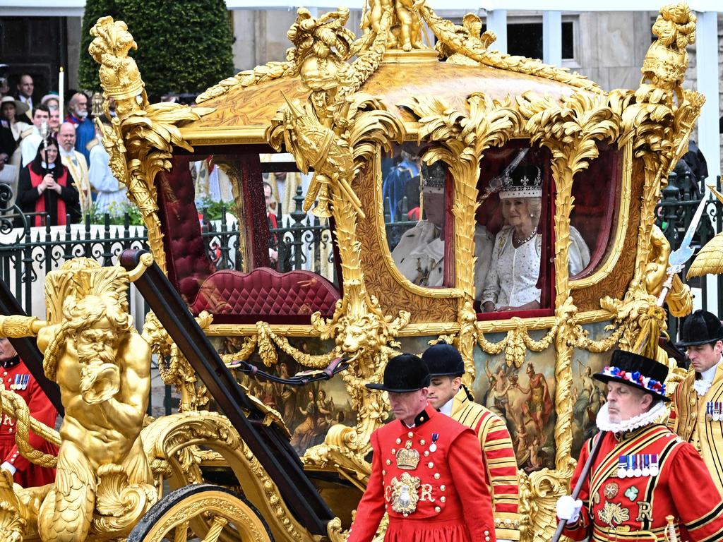 King Charles III and Queen Camilla travel in the Gold State Coach back to Buckingham Palace. Picture: Paul ELLIS / AFP