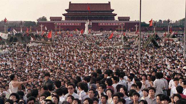 People gathered at Tiananmen Square during a pro-democracy protest in Beijing, in 1989. Picture: Catherine Henriette/Agence France-Presse — Getty Images