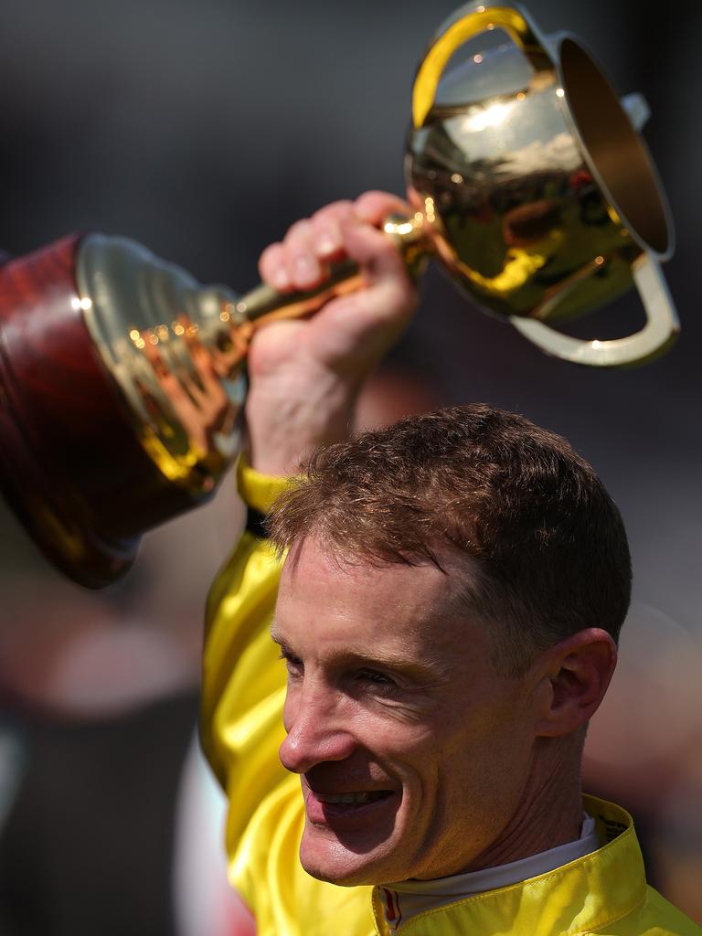 Most of us have only seen the Melbourne Cup in footage or in print in scenes like this one, with jockey Mark Zahra celebrating with the trophy after winning the Lexus Melbourne Cup on Without a Fight during Melbourne Cup Day at Flemington Racecourse on November 07, 2023. Picture: Kelly Defina/Getty Images