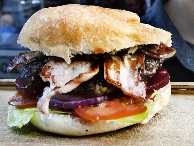 National burger award for Jack Green bar in Hobart, with manager Joe Zucco and one of the special burgers,