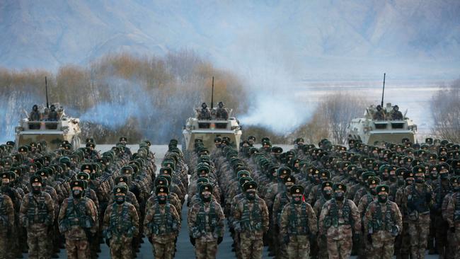 Chinese People's Liberation Army (PLA) soldiers assemble during military training (Photo by AFP)