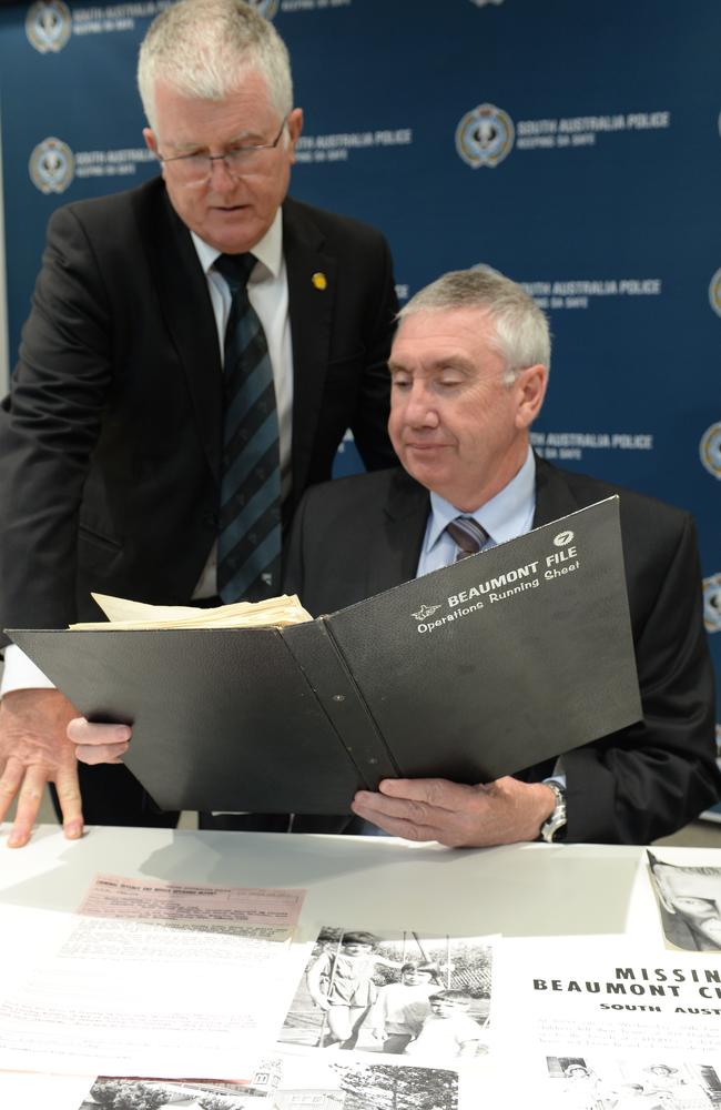 Detective Superintendant Des Bray and Detective Senior Sargent David Scheridar with the first report file. Picture Campbell Brodie.