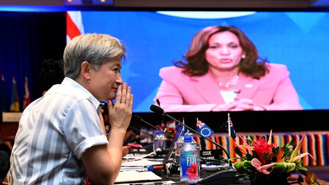 Foreign Affairs Minister Penny Wong, left, listens to US Vice-President Kamala Harris speaking via video-link to the Pacific Islands Forum in Suva today. Picture: AFP