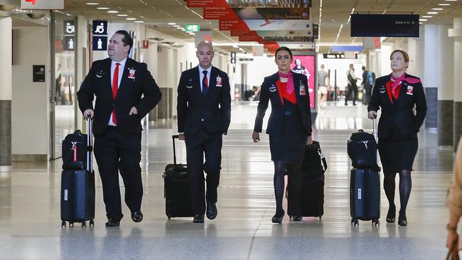 Qantas crew who deal directly with passengers will be required to wear face masks from Wednesday as flights increase. Picture: David Caird