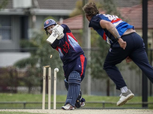 Premier: Dandenong’s Brett Forsyth has his stumps rattled by Jake Reed. Picture: Valeriu Campan