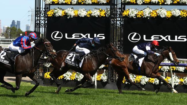 Jye Mcneil riding Twilight Payment wins the Lexus Melbourne Cup ahead of Kerrin McEvoy riding #21 Tiger Moth and Jamie Kah riding #12 Prince Of Arran. Picture: Robert Cianflone/Getty Images for the VRC