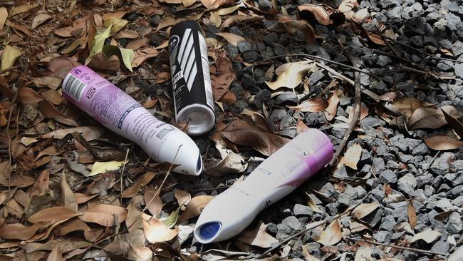 Deodorant cans and glue containers scattered behind a shopping centre believed to be used for chroming.