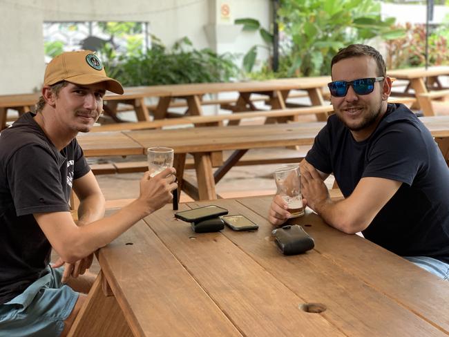 Bowen Basin miners Jayden Keating (left) and Kym Hamilton have a drink together in Sarina. Picture: Duncan Evans