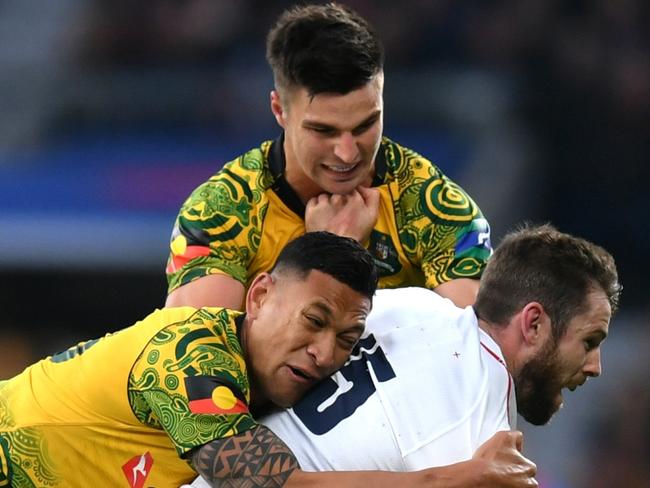 LONDON, ENGLAND - NOVEMBER 24:  Elliot Daly of England is tackled by Israel Folau and Jack Maddocks of Australia during the Quilter International match between England and Australia at Twickenham Stadium on November 24, 2018 in London, United Kingdom.  (Photo by Dan Mullan/Getty Images)