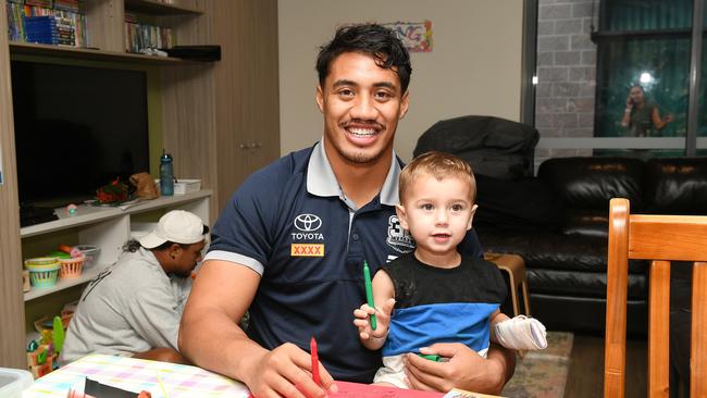 Cowboys Murray Taulagi spreads some joy to young patient Kaleb Macartney, 2, at Townsville University Hospital as part of a special visit in collaboration with Ronald McDonald House Charities. Picture: Shae Beplate.